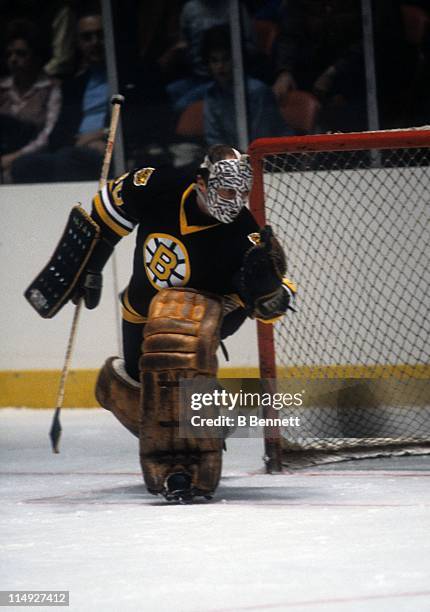 Goalie Gerry Cheevers of the Boston Bruins makes the save during an NHL game in December, 1979.