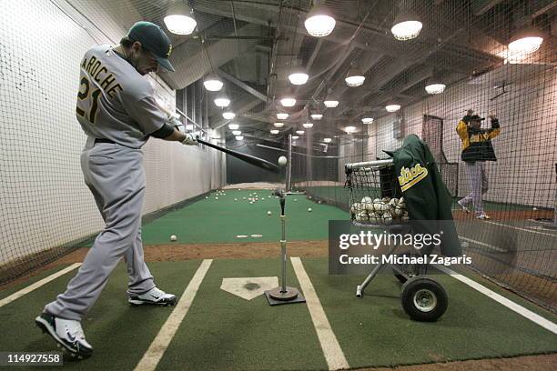 Andy LaRoche of the Oakland Athletics hits in the indoor cages before the game against the San Francisco Giants at AT&T Park on May 20, 2011 in San...