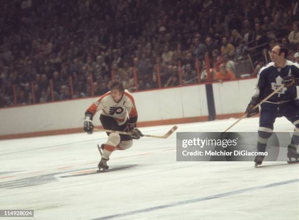 Bobby Clarke of the Philadelphia Flyers skates over the red line during an NHL game against the Toronto Maple Leafs on February 20, 1972 at the...