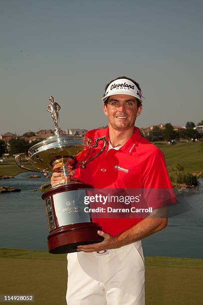 Keegan Bradley poses with the champion's trophy following his victory at the HP Byron Nelson Championship at TPC Four Seasons at Las Colinas on May...