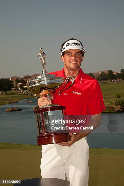 Keegan Bradley poses with the champion's trophy following his victory at the HP Byron Nelson Championship at TPC Four Seasons at Las Colinas on May...