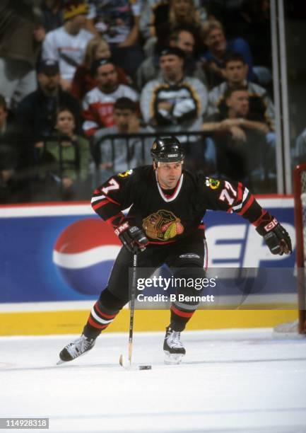 Paul Coffey of the Chicago Blackhawks skates with the puck during an NHL game against the Nashville Predators on November 17, 1998 at the Nashville...