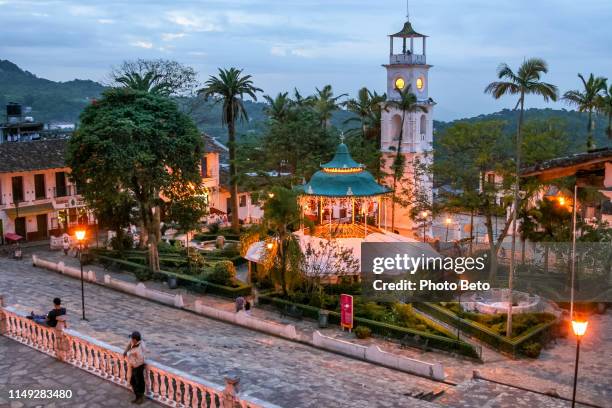 the beautiful main square of the town of cuetzalan in the state of puebla in central mexico - papantla stock pictures, royalty-free photos & images