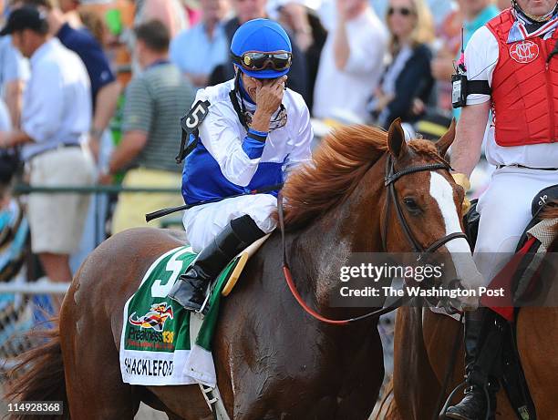 May 21: Shackleford Jockey Jesus Lopez Castanon cries as they head to the winners circle after winning the 136th Preakness Stakes on May 21, 2011 in...