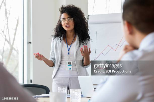 confident medical sales representative meets with medical professionals - rise from the grave stock pictures, royalty-free photos & images