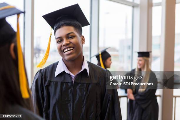 teen boy smiles and laughs with friend - graduation 2019 stock pictures, royalty-free photos & images