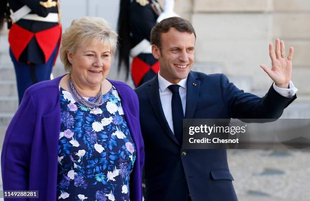 French President Emmanuel Macron welcomes Norwegian Prime Minister Erna Solberg prior to their meeting at the Elysee Palace on May 15, 2019 in Paris,...