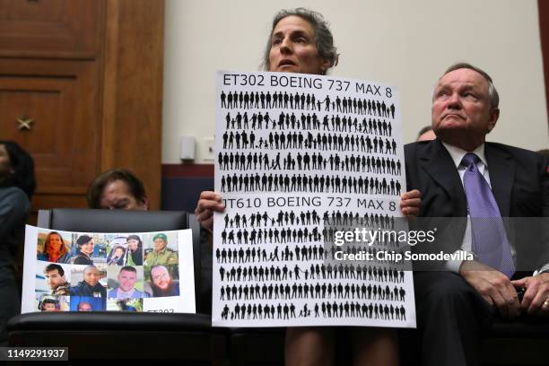 Nadia Milleron, mother of Ethiopian Air crash victim Samya Stumo, holds photographs and signs with silhouettes representing each of the crash victims...