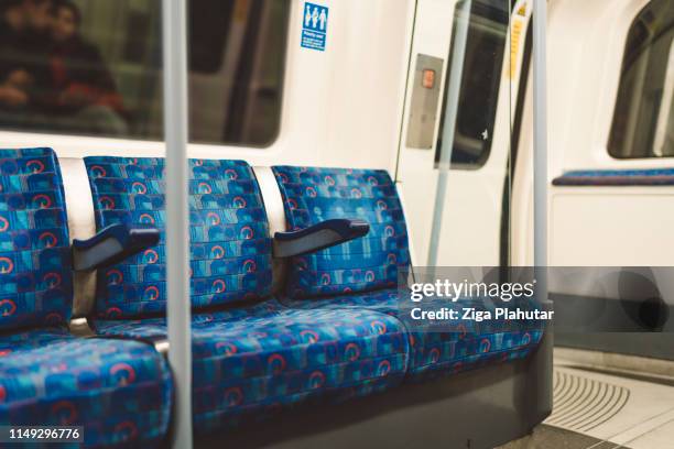 empty seats on a subway train - ziga plahutar stock pictures, royalty-free photos & images