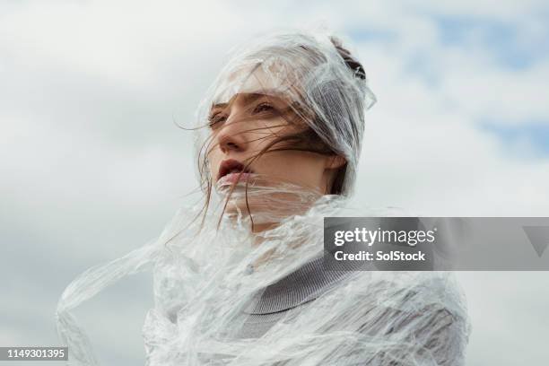 close up portrait wrapped up in plastic - trapped wind stock pictures, royalty-free photos & images