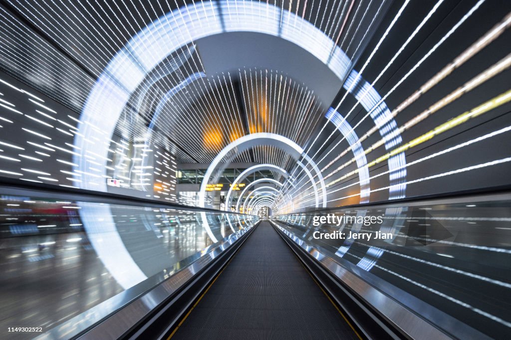 Elevator and tunnel passing through
