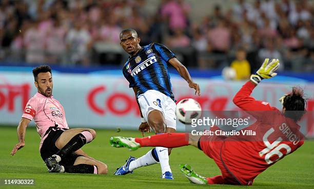 Samuel Eto'o of Inter Milan scores the first goal during the Tim Cup final between FC Internazionale Milano and US Citta di Palermo at Olimpico...