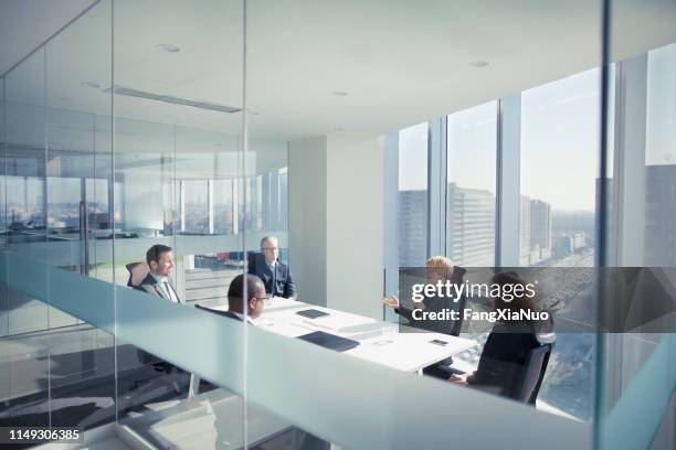 group of business people sitting in meeting - corporate modern office bright diverse stock pictures, royalty-free photos & images