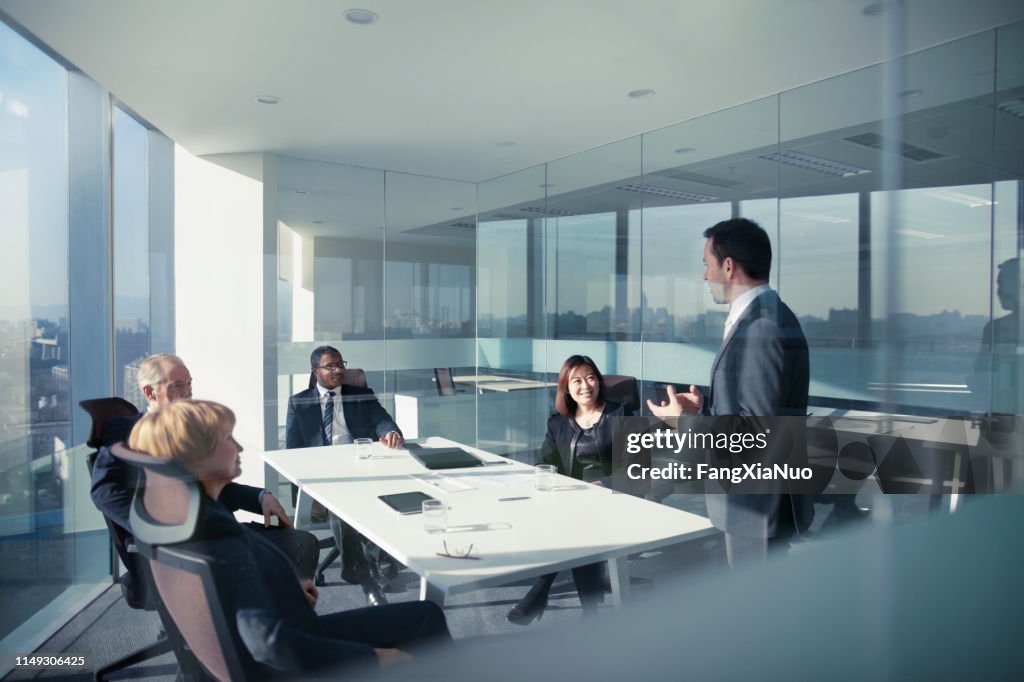 Businessman talking with colleagues in meeting