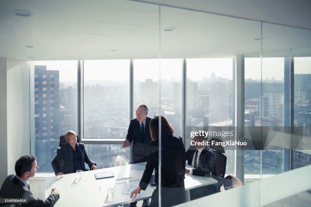 Business colleagues talking in meeting room