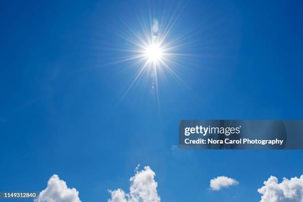 blue sky and sunburst - sun flare clouds sky stock pictures, royalty-free photos & images