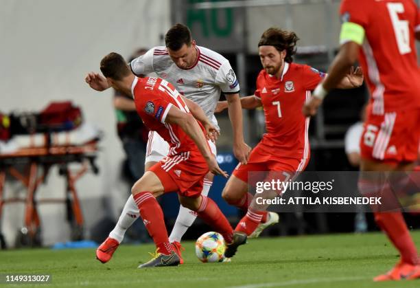 Wales' defender defender James Lawrence and midfielder Joe Allen vie with Hungary's forward Adam Szalai during the UEFA Euro 2020 qualifier Group E...
