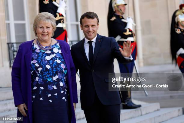 French President Emmanuel Macron welcomes Norwegian Prime Minister Erna Solberg prior to their meeting at the Elysee Palace on May 15, 2019 in Paris,...