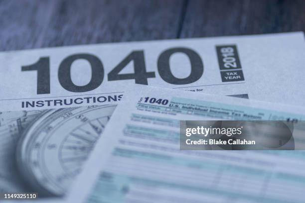 income taxes background with 1040 - tax return ストックフォトと画像