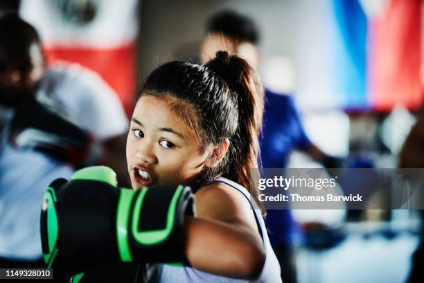 young female boxer shadow boxing while training in gym - sports training bildbanksfoton och bilder