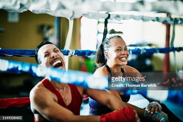 laughing boxers sitting in boxing ring after training session - indian freedom fighters stockfoto's en -beelden