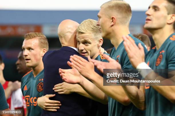 Erik Ten Hag, Manager of Ajax embraces Donny van de Beek of Ajax after winning the Eredivisie following the Eredivisie match between De Graafschap...