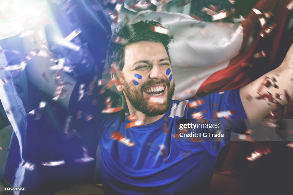 Italian fan celebrating with the national flag