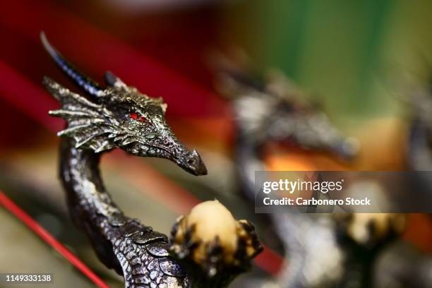red-eyed dragon figures - draco stock pictures, royalty-free photos & images