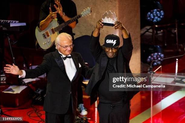 King Carl XVI Gustaf of Sweden presents Grandmaster Flash with his prize during the 2019 Polar Music Prize award ceremony on June 11, 2019 in...