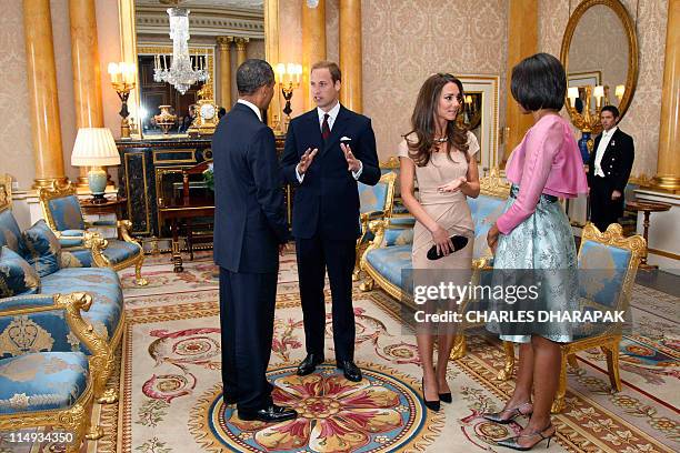 President Barack Obama and US First Lady Michelle Obama meet Britain's Prince William and his wife Catherine at Buckingham Palace, in central London,...