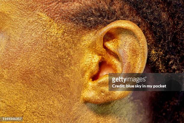 close-up of a golden ear - ear close up women stockfoto's en -beelden