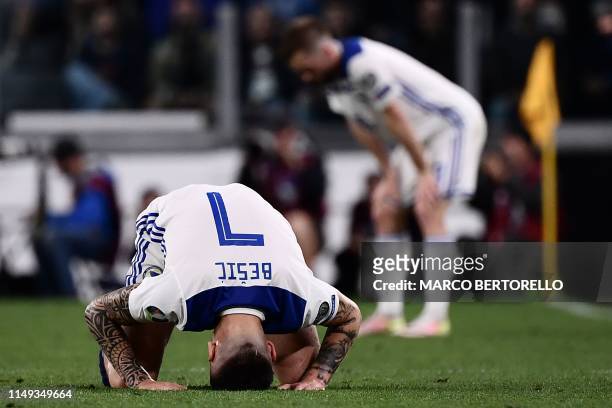 Bosnia Herzegovina's midfielder Muhamed Besic puts his head on the pitch during the UEFA Euro 2020 qualification football match between Italy and...