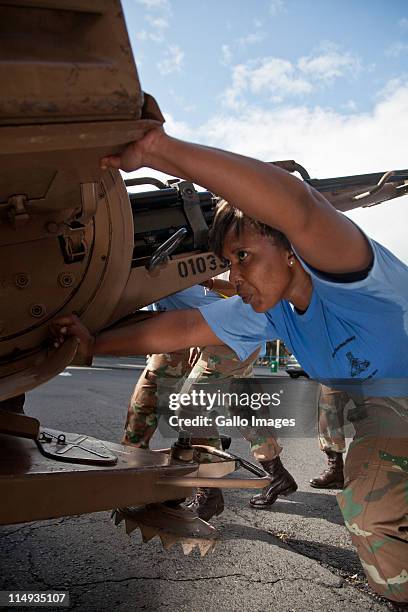 Women soldiers from the Cape Garrison Artillery unit compete in the City of Cape Town artillery gun race on May 28 2011 in Cape Town, South Africa....