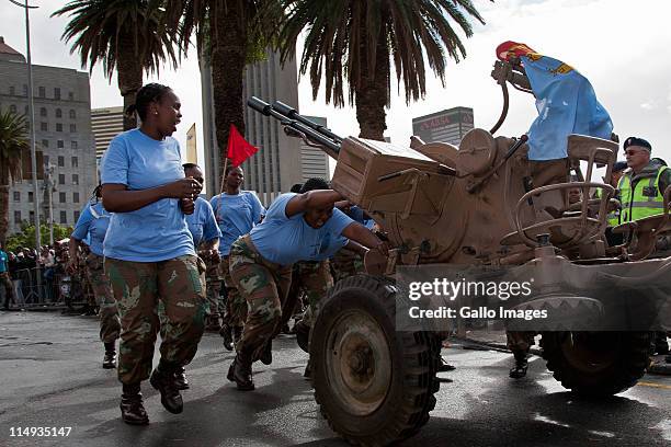 Women soldiers from the Cape Garrison Artillery unit compete in the City of Cape Town artillery gun race on May 28 2011 in Cape Town, South Africa....