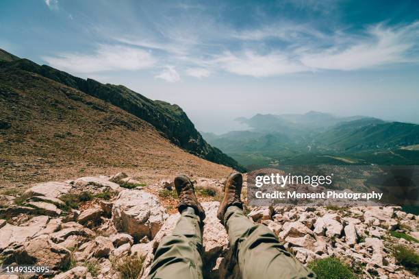 low section of hikers legs on against mountains in turkey - beautiful legs in high heels stock pictures, royalty-free photos & images