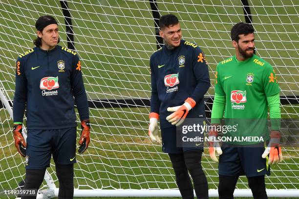 Brazil's goalkeepers Cassio , Ederson and Alisson take part in a training session at the Pacaembu stadium, in Sao Paulo, Brazil, on June 11, 2019...