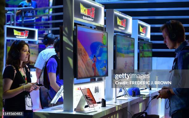 Gaming fans play "Dragon Ball Z Kakarot" at the 2019 Electronic Entertainment Expo, also known as E3, opening in Los Angeles, California on June 11,...