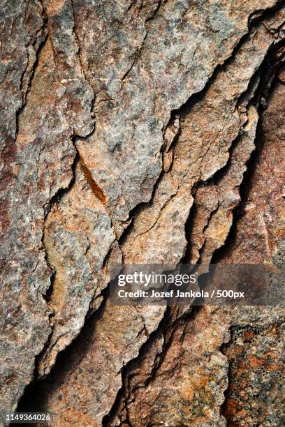 with cracks eroded brownish rock - schist stock pictures, royalty-free photos & images