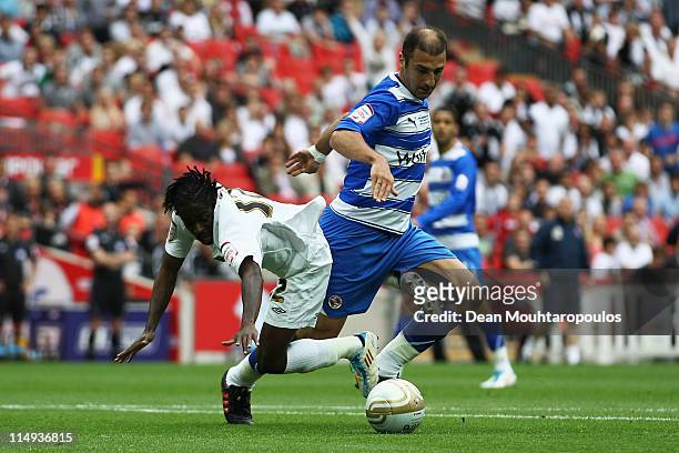Zurab Khizanishvili of Reading tackles and fouls Nathan Dyer of Swansea to give away a penalty during the npower Championship Playoff Final between...