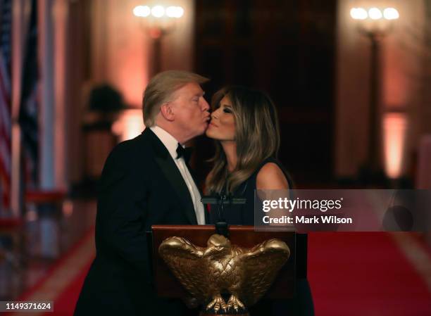 President Donald Trump and first lady Melania Trump attend the White House Historical Association Dinner in the East Room of the White House on May...