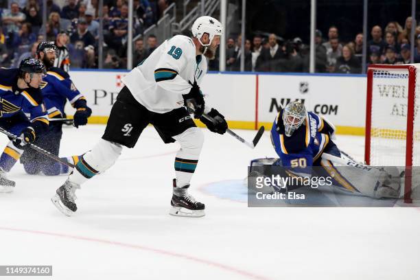 Joe Thornton of the San Jose Sharks scores a goal on Jordan Binnington of the St. Louis Blues during the first period in Game Three of the Western...
