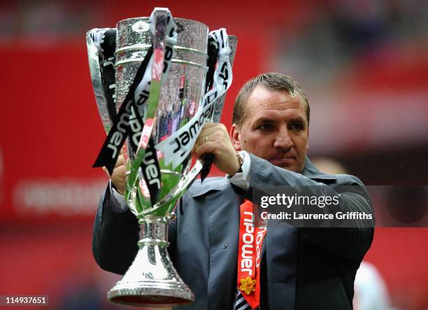Brendan Rogers of Swansea Citycelebrates with the trophy after victory in the npower Championship Playoff Final between Reading and Swansea City at...
