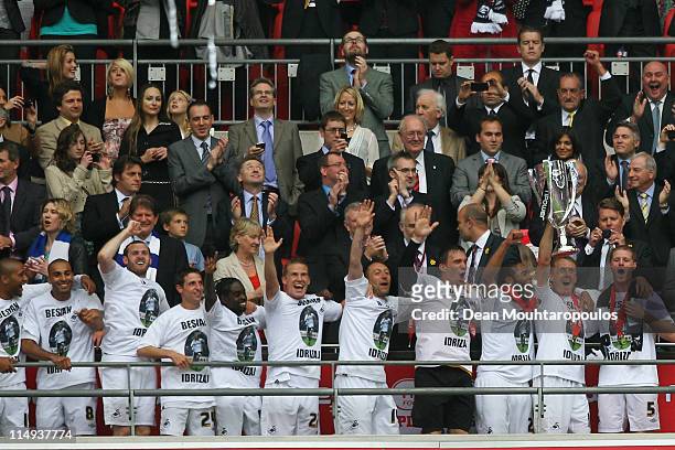 Garry Monk, Captain of Swansea leads celebrations with the trophy after winning the npower Championship Playoff Final between Reading and Swansea...