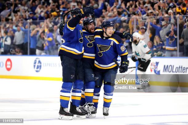 David Perron of the St. Louis Blues celebrates with Colton Parayko and Vladimir Tarasenko after scoring his second goal on Martin Jones of the San...