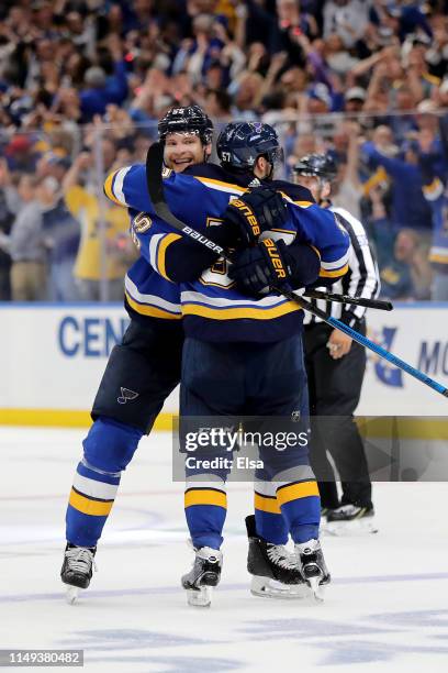 David Perron of the St. Louis Blues celebrates with Colton Parayko after scoring his second goal on Martin Jones of the San Jose Sharks during the...