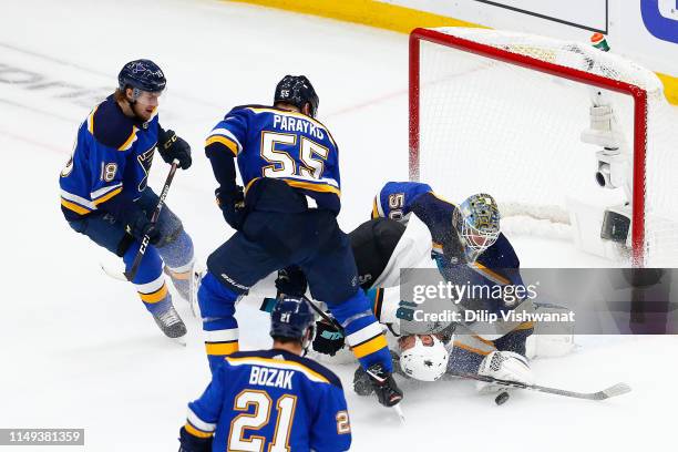 Jordan Binnington of the St. Louis Blues makes a save against Micheal Haley of the San Jose Sharks during the first period in Game Three of the...