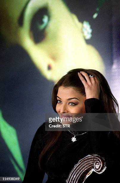 Bollywood actress Aishwarya Rai poses for photographers during the promotion of her signature line jewellery collection "Nakshatra" in Bombay, 07 May...