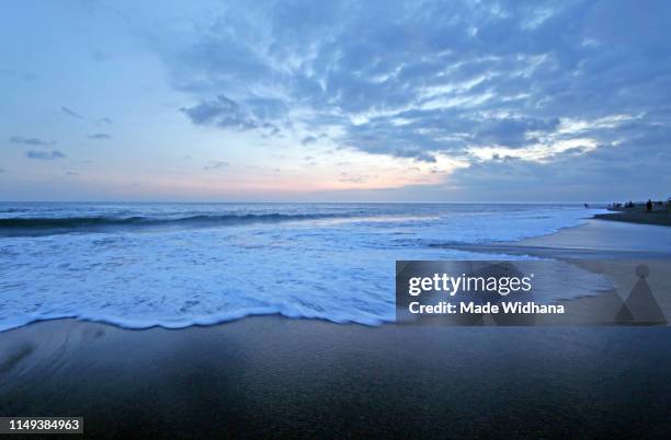 wave, cloud and beautiful sunset sky - made widhana stock pictures, royalty-free photos & images