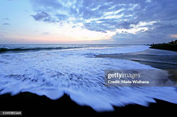 wave, cloud and beautiful sunset sky - made widhana stock pictures, royalty-free photos & images