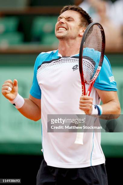 Robin Soderling of Sweden celebrates matchpoint during the men's singles round four match between Gilles Simon of France and Robin Soderling of...
